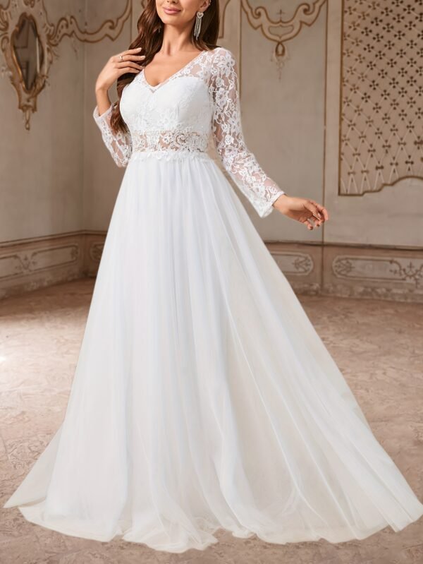 Elegant Wedding Dress with a White Tulle Skirt, Featuring a V-Neck Lace Embroidery And a Flowing Design.